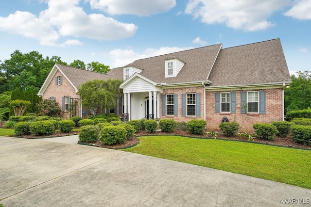 1750 County Road 461, Clanton, AL 35046 - cape cod home with brick siding, a front yard, and roof with shingles