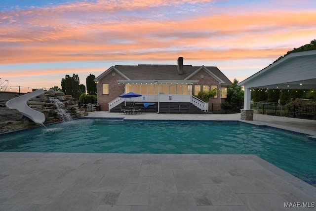 1750 County Road 461, Clanton, AL 35046 - view of pool featuring stairs, a water slide, a patio area, and a pergola