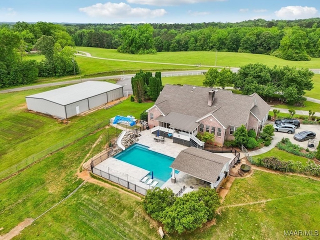1750 County Road 461, Clanton, AL 35046 - aerial view of property and surrounding area with a pool and a heavily wooded area