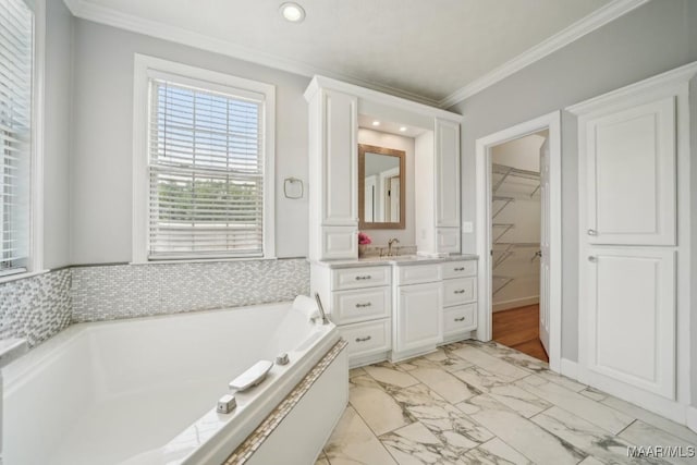 1750 County Road 461, Clanton, AL 35046 - full bathroom with vanity, a garden tub, marble look tile flooring, ornamental molding, and a spacious closet