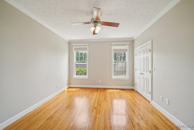1750 County Road 461, Clanton, AL 35046 - spare room with light wood-style flooring, a ceiling fan, a textured ceiling, and ornamental molding