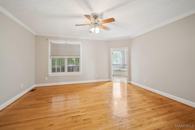 1750 County Road 461, Clanton, AL 35046 - spare room featuring crown molding, ceiling fan, and light wood-type flooring