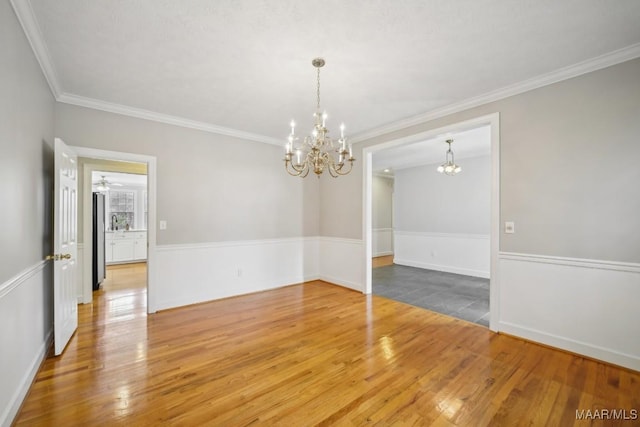 1750 County Road 461, Clanton, AL 35046 - spare room featuring a chandelier, wood finished floors, and crown molding