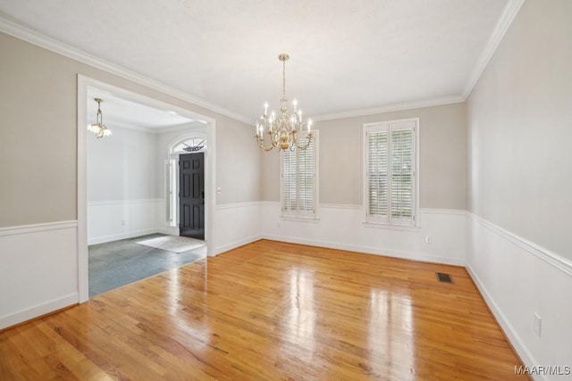 1750 County Road 461, Clanton, AL 35046 - spare room featuring a chandelier, wood finished floors, and crown molding