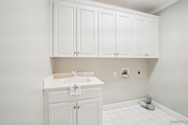1750 County Road 461, Clanton, AL 35046 - washroom featuring electric dryer hookup, cabinet space, washer hookup, light tile patterned floors, and ornamental molding