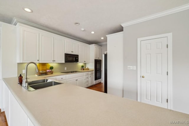1750 County Road 461, Clanton, AL 35046 - kitchen featuring black appliances, crown molding, white cabinetry, light countertops, and recessed lighting