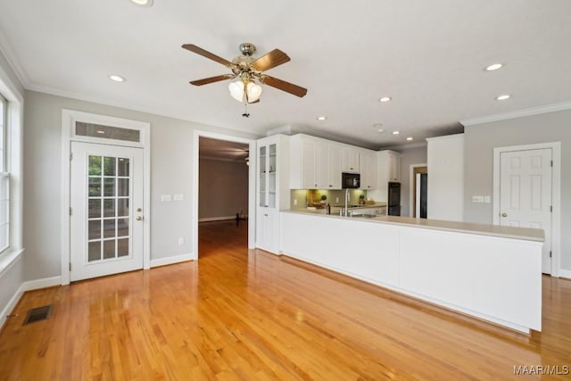 1750 County Road 461, Clanton, AL 35046 - unfurnished living room with ornamental molding, recessed lighting, light wood-style floors, and ceiling fan