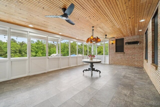1750 County Road 461, Clanton, AL 35046 - unfurnished sunroom featuring a ceiling fan and a chandelier