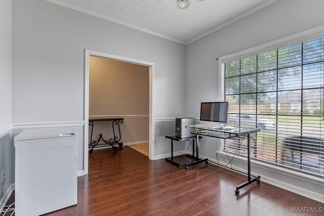 office featuring crown molding, baseboards, a textured ceiling, and wood finished floors