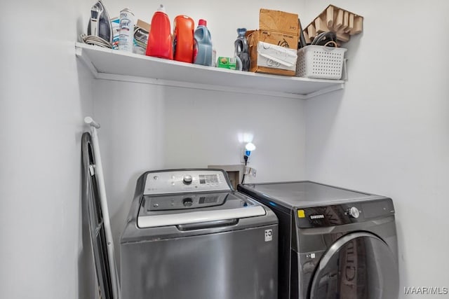laundry room featuring laundry area and washing machine and clothes dryer