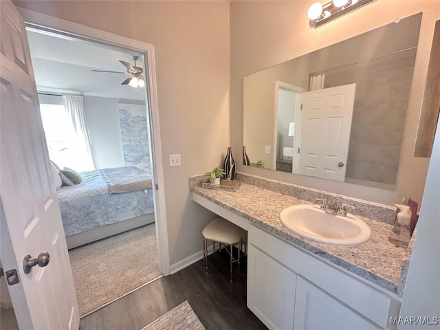 178 Canal Xing, Wetumpka, AL 36092 - bathroom featuring ensuite bath, wood finished floors, vanity, a ceiling fan, and baseboards