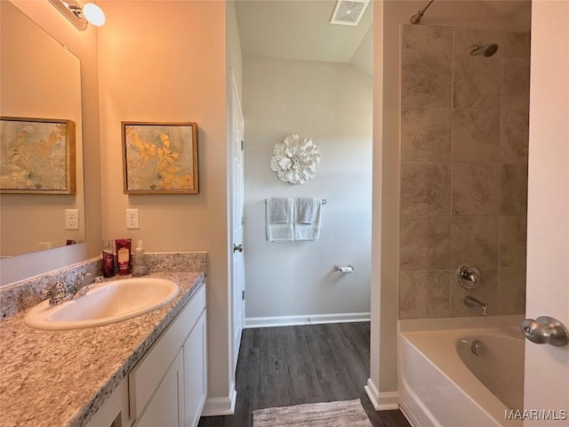 178 Canal Xing, Wetumpka, AL 36092 - bathroom featuring vanity, wood finished floors, tub / shower combination, and baseboards