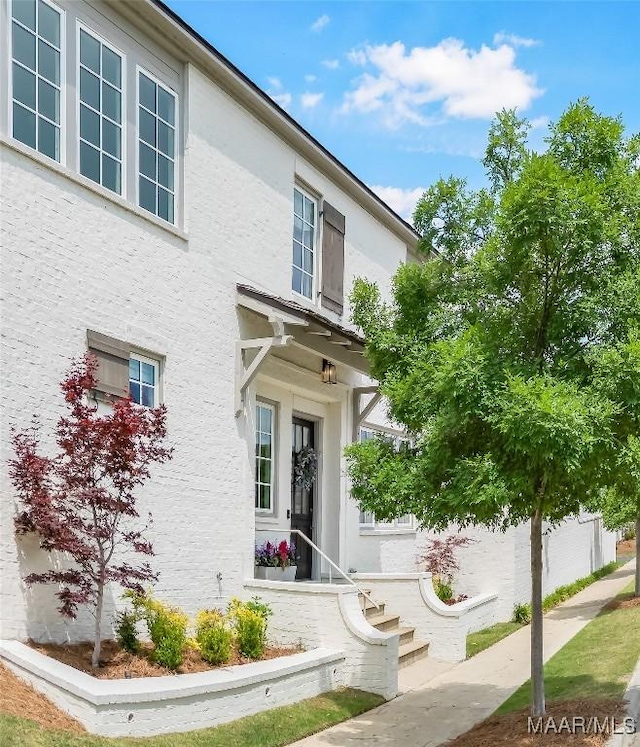 doorway to property with stucco siding