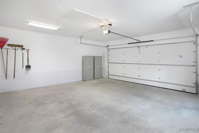 garage featuring a garage door opener