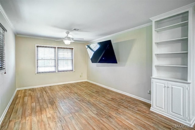 empty room featuring baseboards, ceiling fan, ornamental molding, and light wood-style flooring