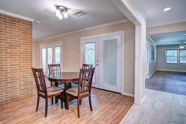 dining room featuring ceiling fan, visible vents, plenty of natural light, and french doors
