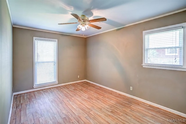 unfurnished room with baseboards and plenty of natural light