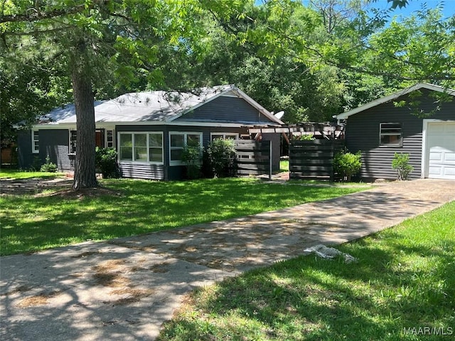 223 Mcdonald Ave, Selma, AL 36701 - view of front of home featuring a garage, driveway, and a front yard