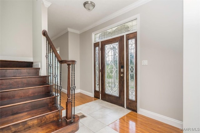 211 Carter Ln, Valley Grande, AL 36703 - entrance foyer with baseboards, crown molding, stairway, and wood finished floors