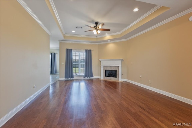 603 Coleman Way, Prattville, AL 36067 - unfurnished living room featuring wood finished floors, a tray ceiling, a fireplace, visible vents, and ceiling fan