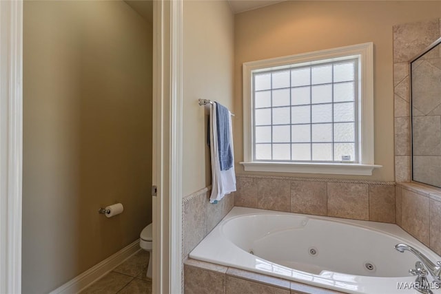 603 Coleman Way, Prattville, AL 36067 - bathroom featuring toilet, tile patterned flooring, a jetted tub, and baseboards