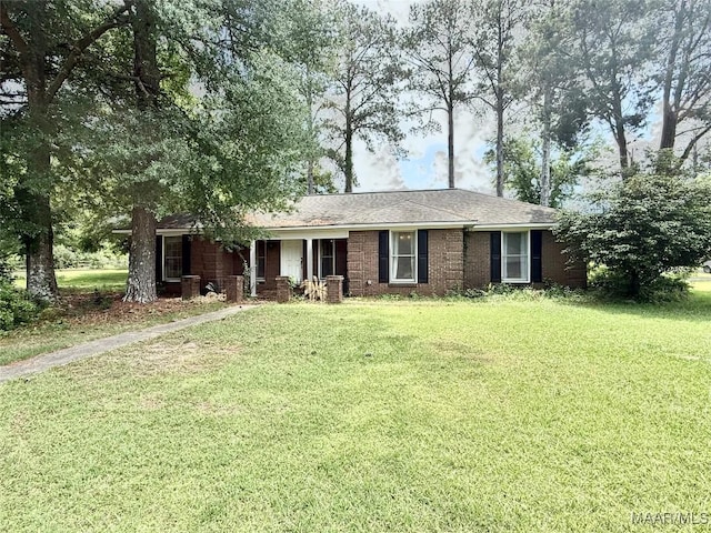109 Lashley Dr, Selma, AL 36701 - ranch-style home with covered porch, roof with shingles, and a front lawn