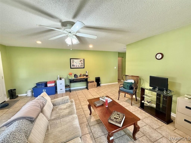 109 Lashley Dr, Selma, AL 36701 - living area featuring a ceiling fan, baseboards, light tile patterned floors, and a textured ceiling