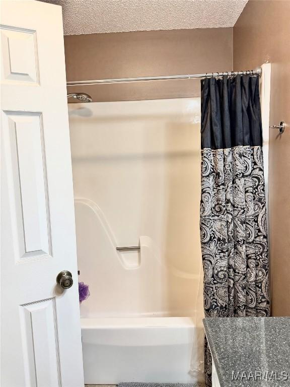 109 Lashley Dr, Selma, AL 36701 - full bath with a textured ceiling and shower / bath combo with shower curtain