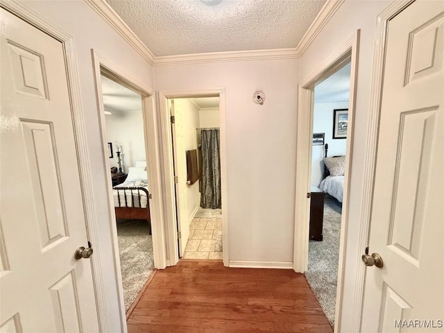 109 Lashley Dr, Selma, AL 36701 - hall featuring carpet, crown molding, a textured ceiling, and wood finished floors