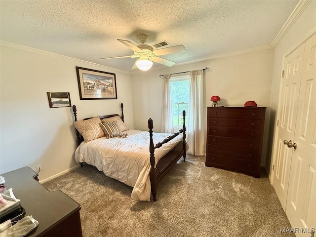 109 Lashley Dr, Selma, AL 36701 - bedroom with carpet flooring, a closet, a textured ceiling, and ornamental molding