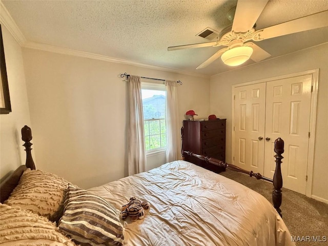 109 Lashley Dr, Selma, AL 36701 - bedroom with a closet, a textured ceiling, dark colored carpet, ceiling fan, and crown molding
