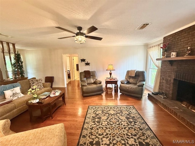 109 Lashley Dr, Selma, AL 36701 - living area featuring ceiling fan, a textured ceiling, visible vents, and wood finished floors