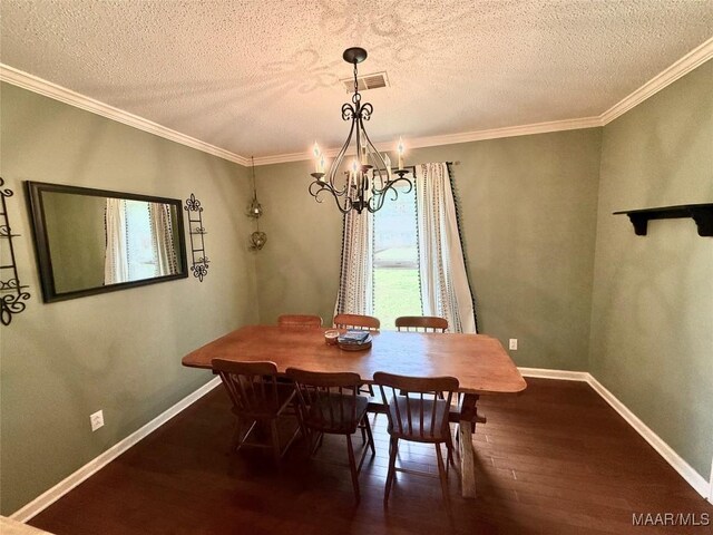 109 Lashley Dr, Selma, AL 36701 - dining space featuring a textured ceiling, ornamental molding, an inviting chandelier, visible vents, and hardwood / wood-style flooring