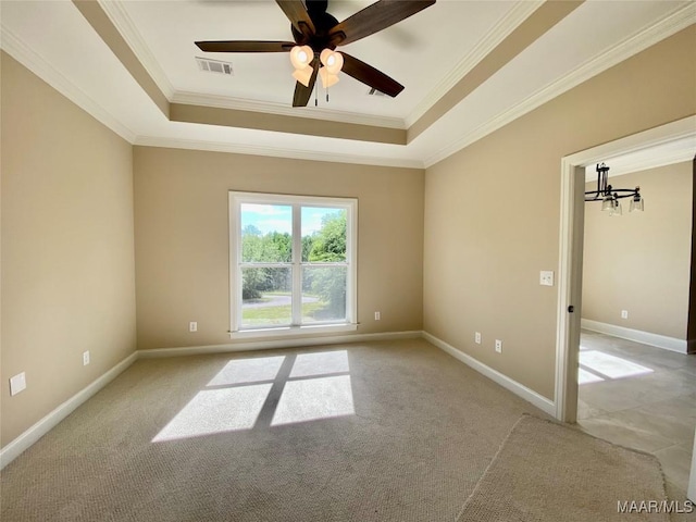 unfurnished bedroom with light carpet, a raised ceiling, visible vents, and ornamental molding