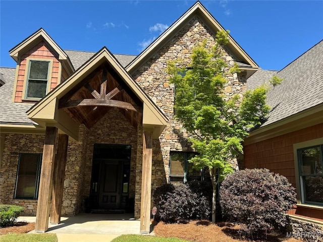 155 Edge Wood Ct, Mathews, AL 36052 - doorway to property featuring stone siding and a shingled roof