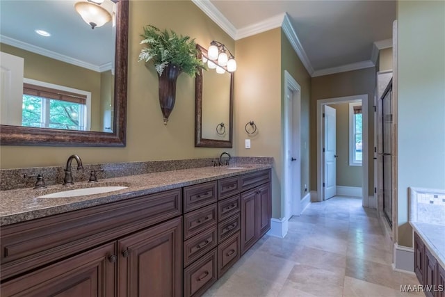 155 Edge Wood Ct, Mathews, AL 36052 - bathroom with baseboards, crown molding, healthy amount of natural light, double vanity, and a stall shower