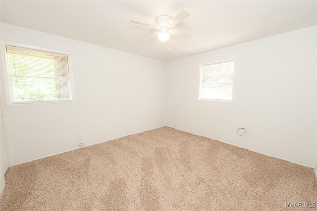 1701 Sylvan Dr, Montgomery, AL 36106 - spare room featuring carpet, healthy amount of natural light, and a ceiling fan