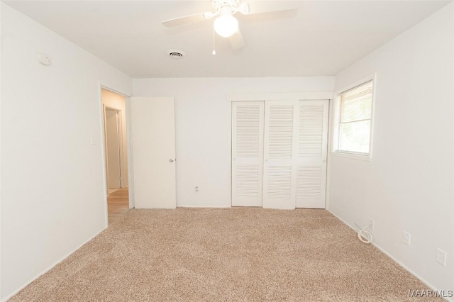 1701 Sylvan Dr, Montgomery, AL 36106 - unfurnished bedroom featuring carpet, a closet, and a ceiling fan