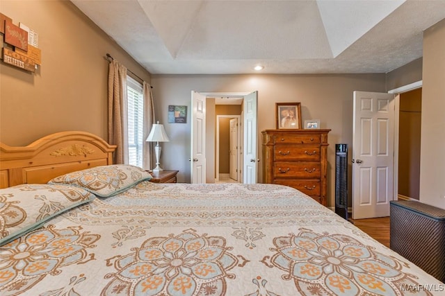 bedroom with wood finished floors