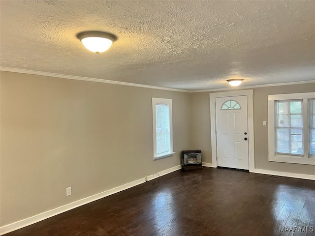 entrance foyer with baseboards, heating unit, a textured ceiling, and dark wood-type flooring