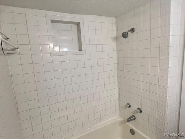 bathroom with washtub / shower combination