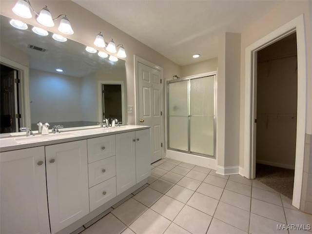1939 Cedar Ridge Loop, Prattville, AL 36067 - full bath with a stall shower, tile patterned flooring, double vanity, a walk in closet, and recessed lighting