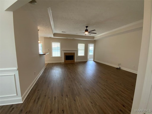 1939 Cedar Ridge Loop, Prattville, AL 36067 - unfurnished living room featuring a ceiling fan, dark wood-type flooring, baseboards, crown molding, and a textured ceiling