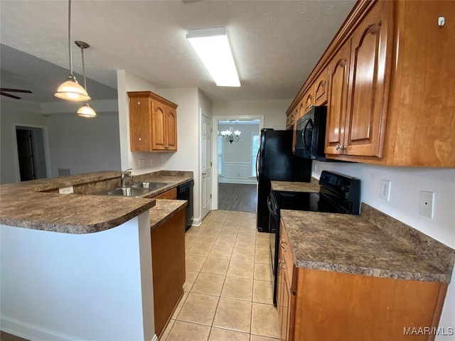 1939 Cedar Ridge Loop, Prattville, AL 36067 - kitchen with a sink, black appliances, dark countertops, a peninsula, and a textured ceiling