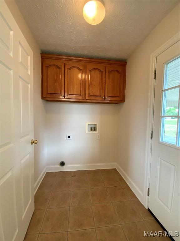 1939 Cedar Ridge Loop, Prattville, AL 36067 - washroom with hookup for a washing machine, hookup for an electric dryer, tile patterned flooring, baseboards, and cabinet space