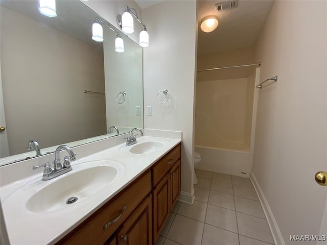 1939 Cedar Ridge Loop, Prattville, AL 36067 - full bathroom with toilet, double vanity, tile patterned floors, bathing tub / shower combination, and baseboards
