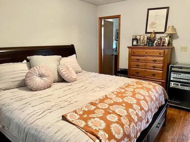 bedroom featuring dark wood-type flooring
