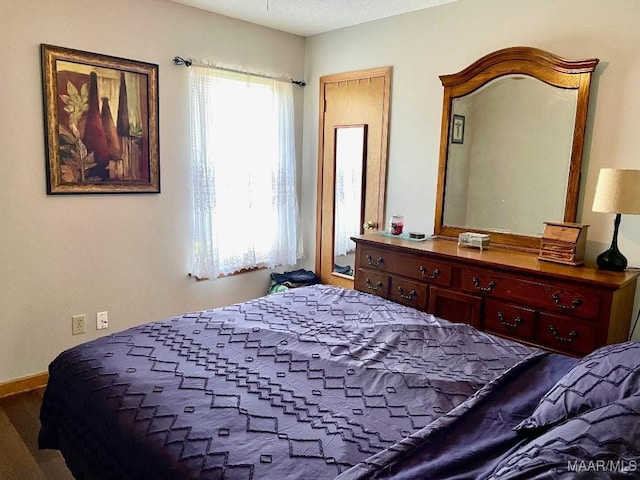 bedroom with wood finished floors