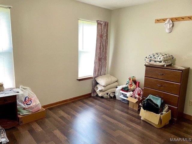 miscellaneous room featuring wood finished floors and baseboards