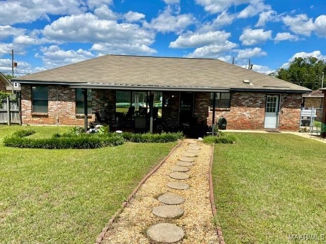 back of house featuring brick siding
